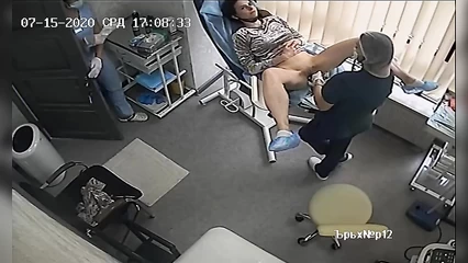 Gynecologists remove and insert an IUD into a woman