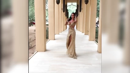 Busty model in a long dress