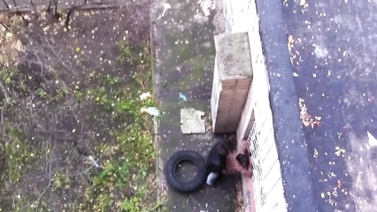 From my balcony I filmed a couple fucking against the wall