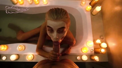Romantic blowjob in the bath by candlelight