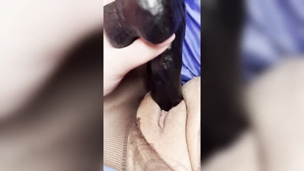 Tears pantyhose to insert a toy