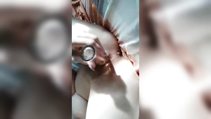 Busty fucks herself with a bottle