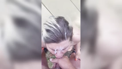Naked whore gets jizzed all over her face