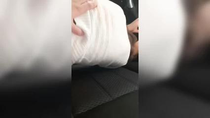 Olya gives it to Misha in the car