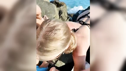 Blowjob on a wild beach