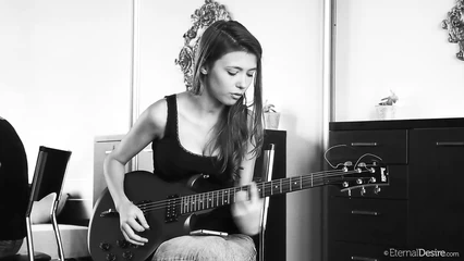 Ekaterina Volkova plays the guitar and sings