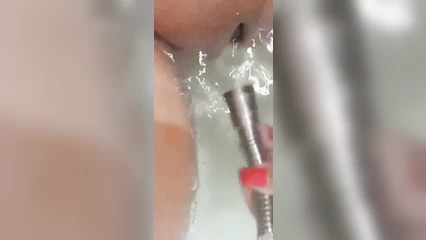 A powerful jet of water on the clitoris