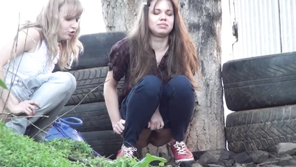 Spying on pissing chicks under a tree