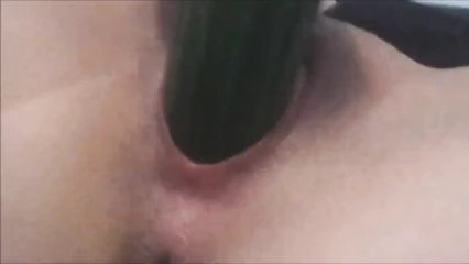 Playing with a ripe cucumber