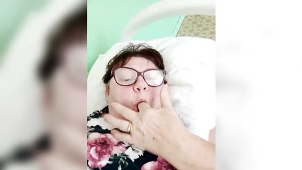 She fucks herself in the mouth with her finger