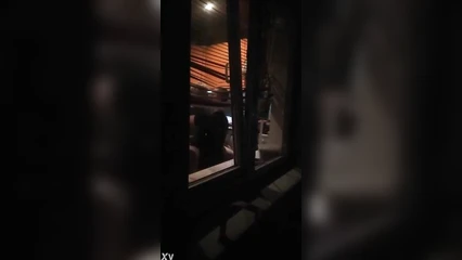 My wife passionately kisses a young man on the balcony