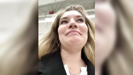Blonde girl chatting in a shopping mall
