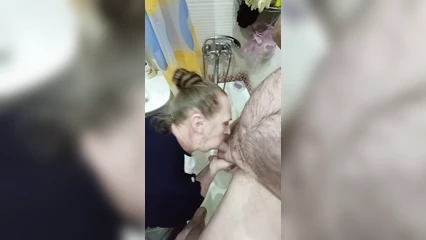 The mature woman takes and sucks, and I cum in her mouth