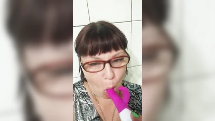 Woman sucks her vibrator