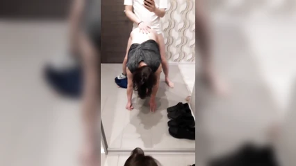 Sanyok bends over his acquaintance in front of the mirror