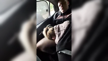Fat guy waffles a prostitute in a car on the highway