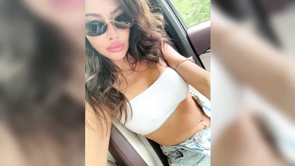 Sexy Nirvana in glasses in the car