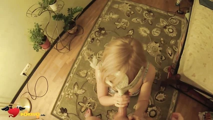 On his knees, a nipple in a mask sucks off the penis