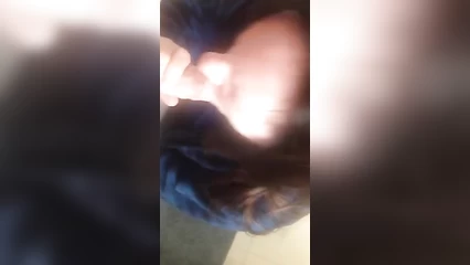 A mature woman skillfully sucks the head