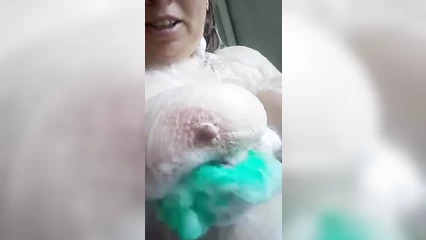 Mature washes big tits in the shower
