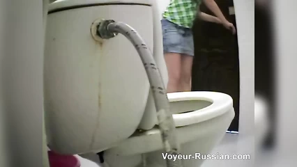 The chick lifted her miniskirt and pissed in the toilet