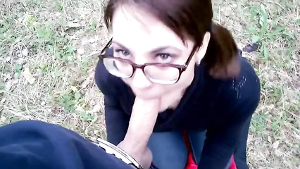 Forest blowjob of a bespectacled girl