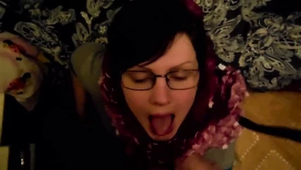 Evening cumshot on the mouth of a girl with glasses