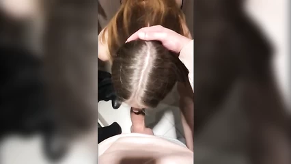 Lena gives her boyfriend a blowjob in the fitting room