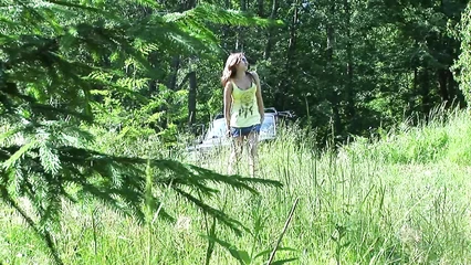 She made it to the forest and, getting out of the car, ran to pee behind a tree.