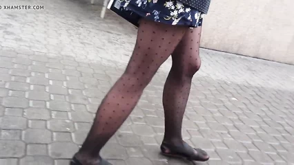 In tights and sandals