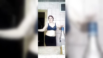 Striptease of a mature red-haired mother
