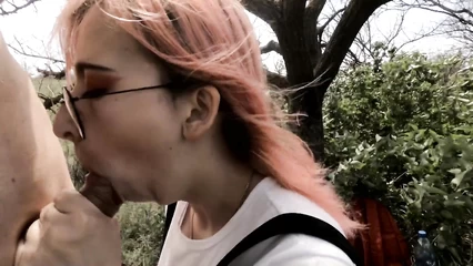 Nerd girl sucks under a tree