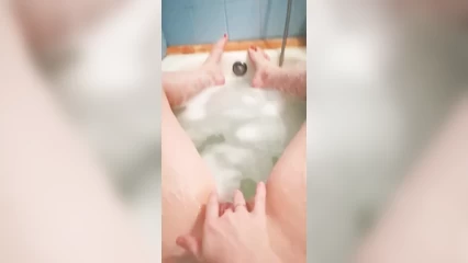 Fingering pussy in the bath